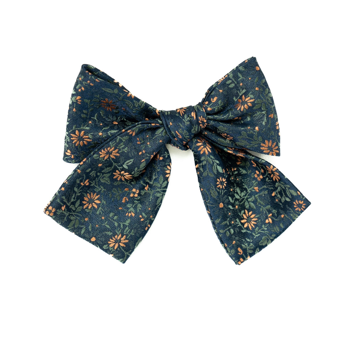 Navy floral petite hair bow with orange and green accents, tied ribbon knot.