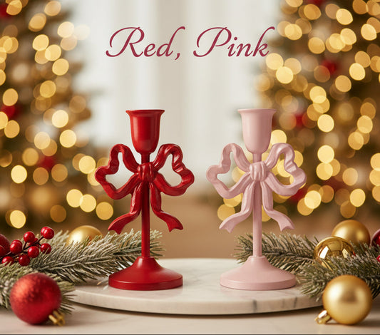 Bow taper candle holders, red and pink cast iron, with fluted candle cups