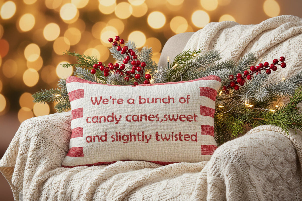 Holiday lumbar pillow with candy cane message and holly sprig applique on cream